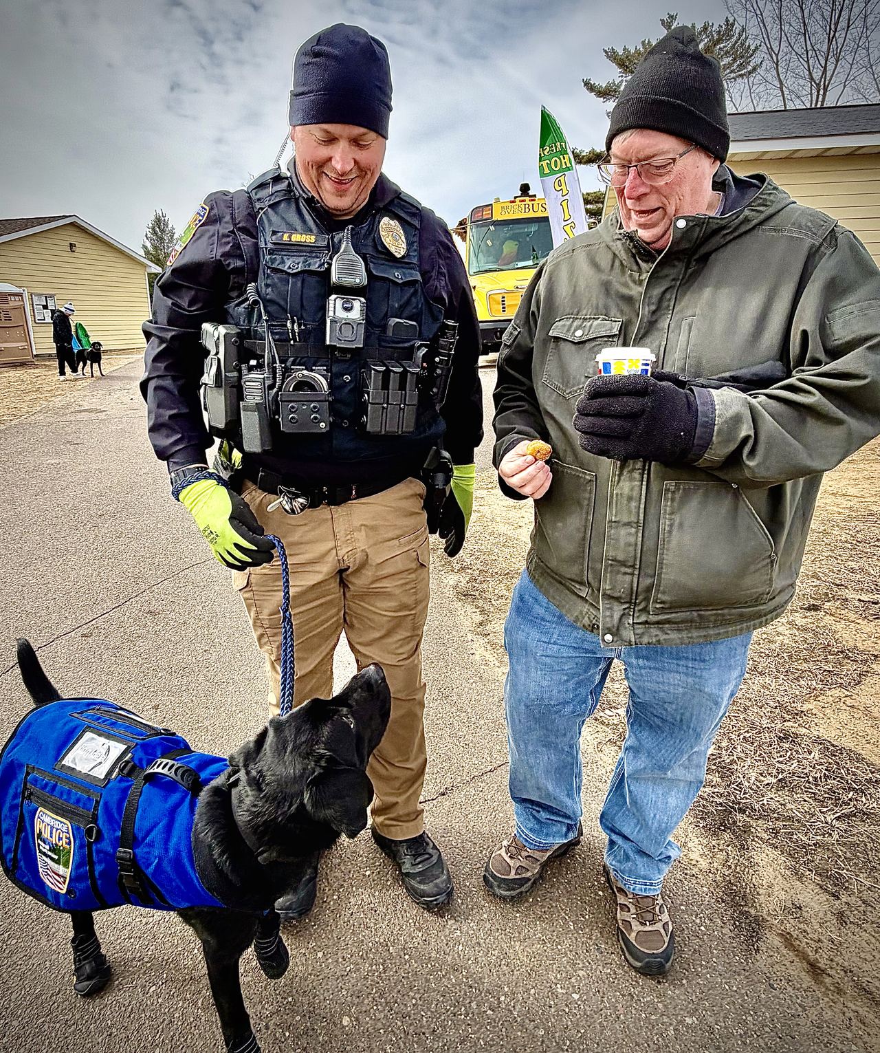 Jim, Jack the therapy K9, and Officer Gross hosting Winterfest 2026